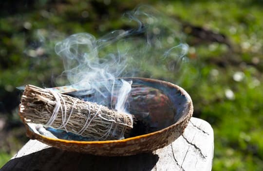 Burning sage and a smudge stick