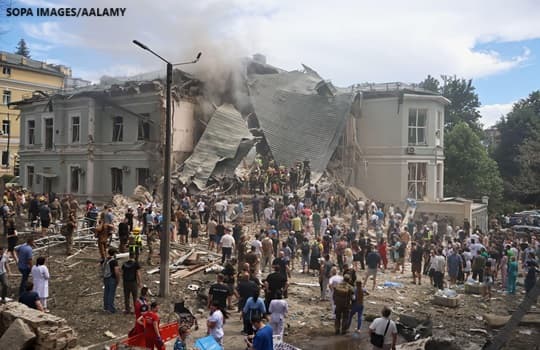 People search for victims after the Russian army launched a rocket attack on the "Ohmatdyt" children's clinic