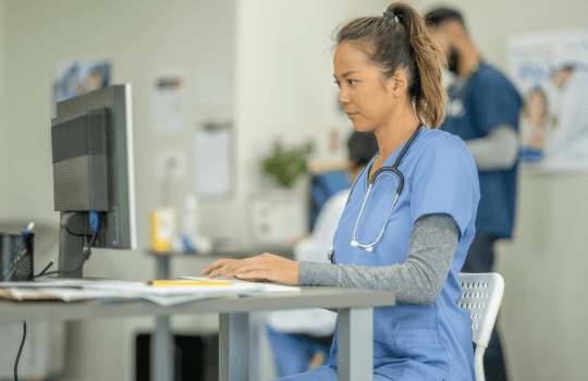 nurse using a computer