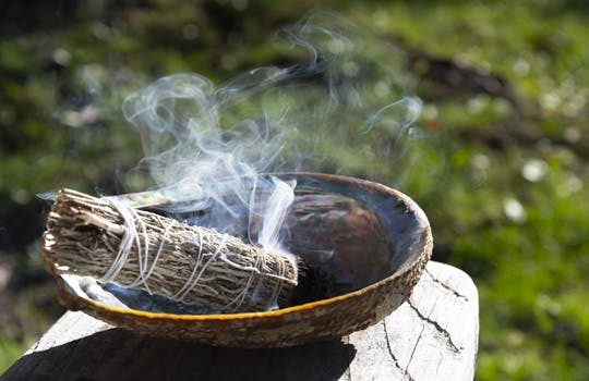 Burning sage and a smudge stick