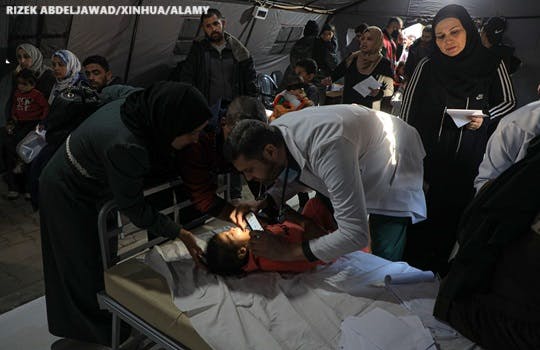 A child receives treatment at a temporary hospital in the southern Gaza Strip city of Rafah in January 2024