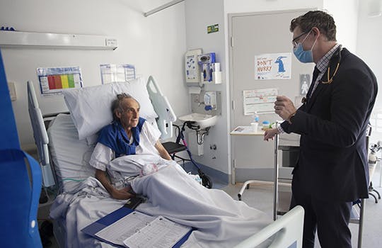 Australia hospital - older patient and doctor