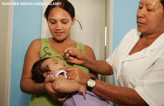 A child is vaccinated against Polio in Brazil